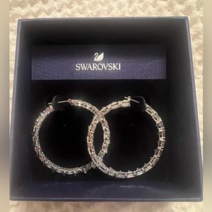 Gorgeous Swarovski hoops brand new with tags and box. Never worn! Beautiful!